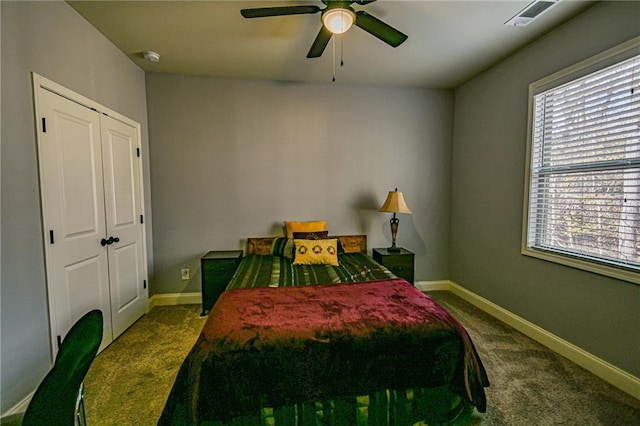 carpeted bedroom with a closet and ceiling fan