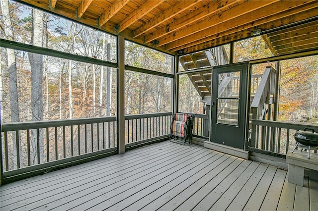 unfurnished sunroom featuring a wealth of natural light