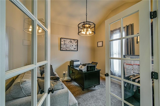 carpeted office with french doors, lofted ceiling, and a notable chandelier