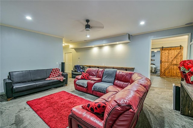 living room with a barn door, ceiling fan, light tile patterned floors, and ornamental molding