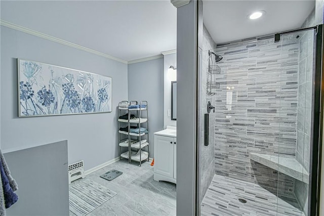 bathroom featuring vanity, a shower with door, and ornamental molding