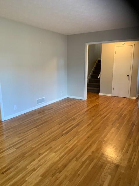 spare room featuring light hardwood / wood-style floors