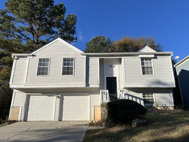 bi-level home featuring a garage