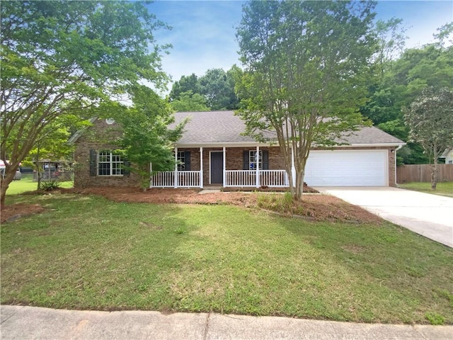 2012 Elm Grove Ln, Hampton, GA 30228 - single story home with a porch, brick siding, concrete driveway, and a garage