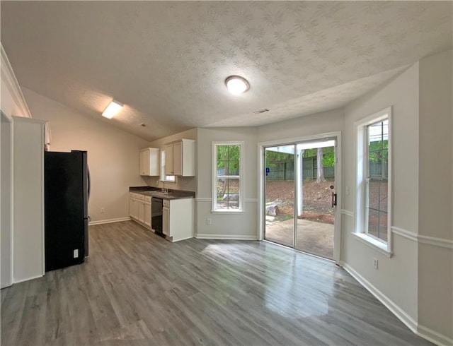 2012 Elm Grove Ln, Hampton, GA 30228 - kitchen featuring freestanding refrigerator, dark countertops, baseboards, dark wood-style floors, and dishwasher