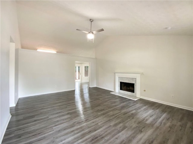 2012 Elm Grove Ln, Hampton, GA 30228 - unfurnished living room with a ceiling fan, a high end fireplace, baseboards, high vaulted ceiling, and dark wood-type flooring