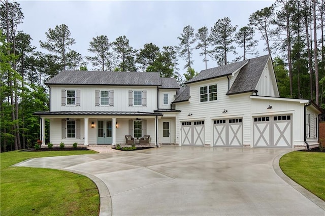 modern farmhouse style home with driveway, a porch, board and batten siding, a shingled roof, and a standing seam roof