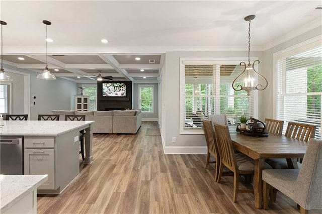 dining room featuring ornamental molding, coffered ceiling, light wood-type flooring, a ceiling fan, and baseboards
