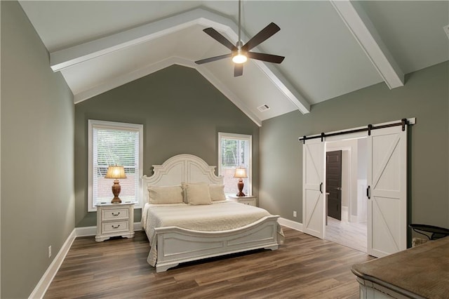 bedroom with a barn door, dark wood finished floors, baseboards, and a ceiling fan