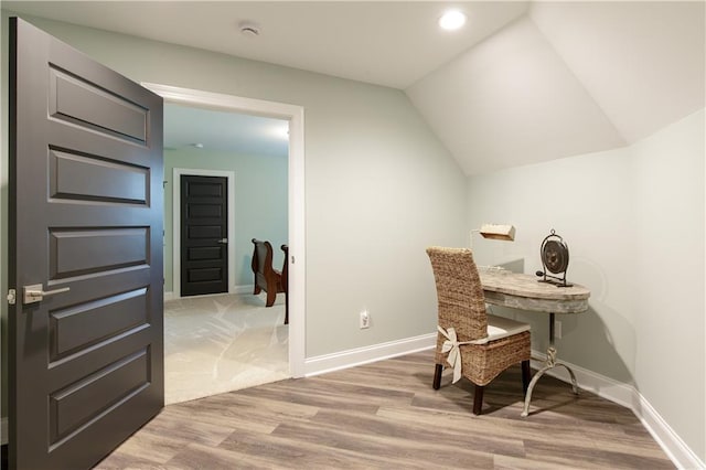 home office featuring light wood finished floors, baseboards, recessed lighting, and vaulted ceiling