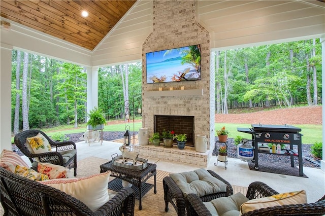 view of patio / terrace featuring an outdoor living space with a fireplace