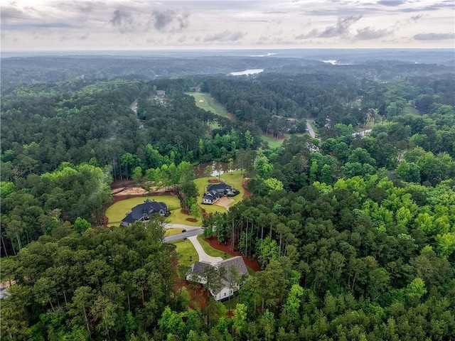 view of property location featuring a heavily wooded area