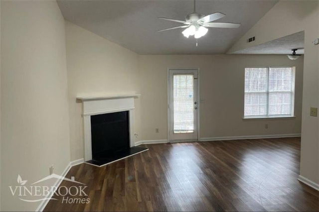 504 Edgewood Trce, Mcdonough, GA 30253 - unfurnished living room with vaulted ceiling, wood finished floors, a ceiling fan, and a fireplace with raised hearth