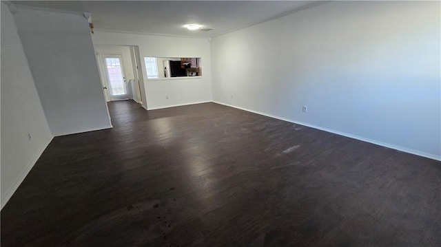 empty room with dark hardwood / wood-style floors