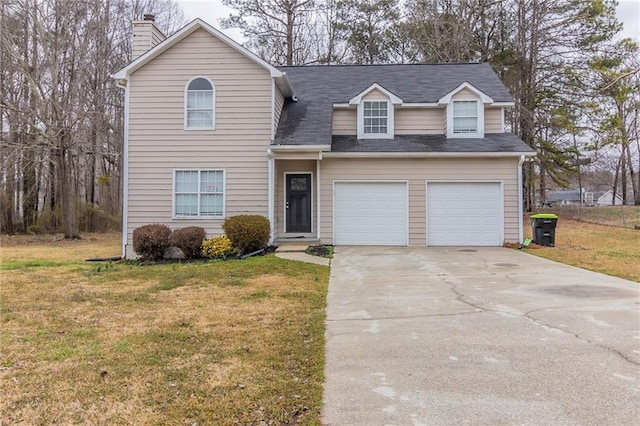 traditional-style home with a front lawn, concrete driveway, a garage, and a chimney