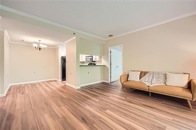 1800 Clairmont Lk Unit A310, Decatur, GA 30033 - living area with a chandelier, light wood finished floors, crown molding, and a textured ceiling