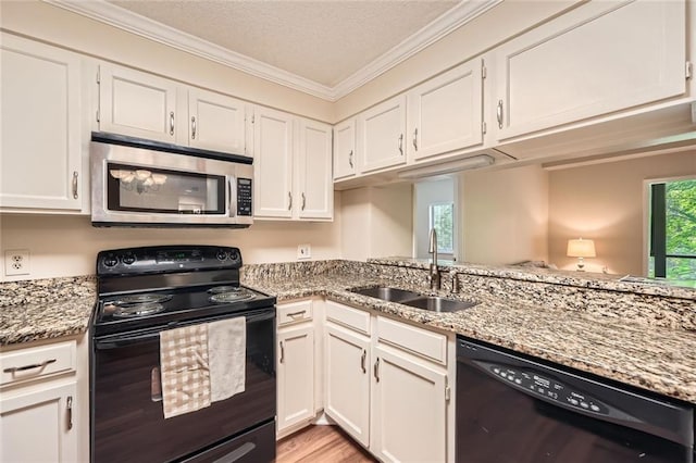 1800 Clairmont Lk Unit A310, Decatur, GA 30033 - kitchen featuring black appliances, white cabinets, ornamental molding, light stone countertops, and light wood-type flooring
