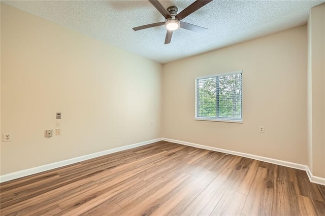 1800 Clairmont Lk Unit A310, Decatur, GA 30033 - empty room featuring wood finished floors, a ceiling fan, and a textured ceiling