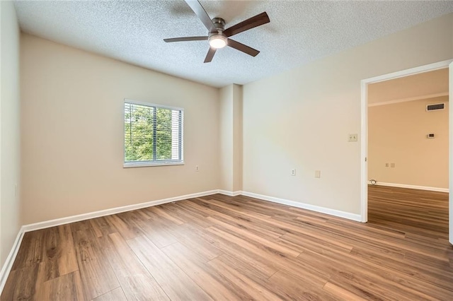 1800 Clairmont Lk Unit A310, Decatur, GA 30033 - spare room with a ceiling fan, light wood-style floors, and a textured ceiling