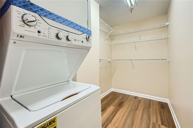1800 Clairmont Lk Unit A310, Decatur, GA 30033 - washroom featuring washer / clothes dryer, wood finished floors, and a textured ceiling