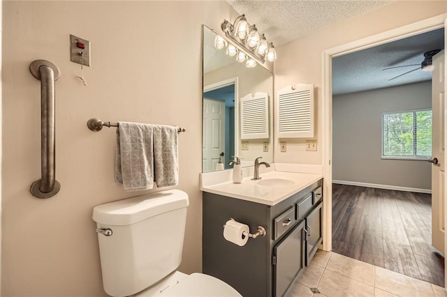 1800 Clairmont Lk Unit A310, Decatur, GA 30033 - bathroom with a textured ceiling, vanity, a ceiling fan, and wood finished floors