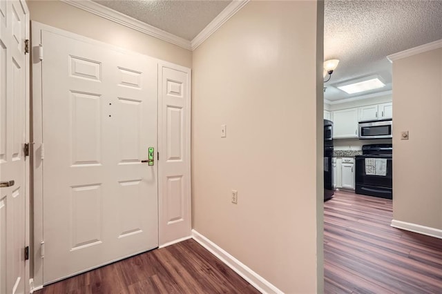 1800 Clairmont Lk Unit A310, Decatur, GA 30033 - entrance foyer featuring a textured ceiling, dark wood-type flooring, and ornamental molding