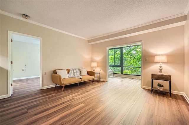 1800 Clairmont Lk Unit A310, Decatur, GA 30033 - sitting room with a textured ceiling, crown molding, wood finished floors, and a baseboard heating unit