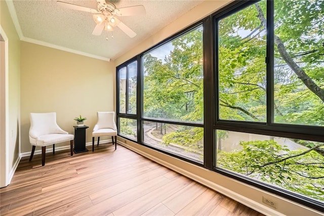 1800 Clairmont Lk Unit A310, Decatur, GA 30033 - sunroom / solarium featuring a baseboard heating unit, a textured ceiling, wood finished floors, and crown molding
