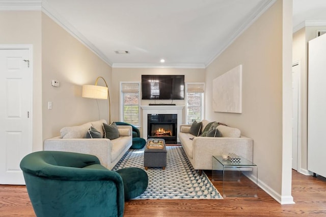 living room featuring hardwood / wood-style floors and ornamental molding