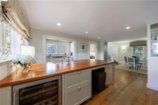 202 Lakeview Ave, Atlanta, GA 30305 - interior space featuring wine cooler, ornamental molding, stairway, and dark wood-type flooring