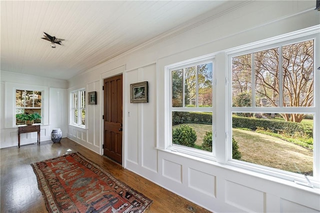 202 Lakeview Ave, Atlanta, GA 30305 - foyer entrance featuring a decorative wall, wooden ceiling, crown molding, and wood finished floors