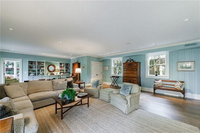 202 Lakeview Ave, Atlanta, GA 30305 - living room featuring crown molding, visible vents, baseboards, and light wood-type flooring
