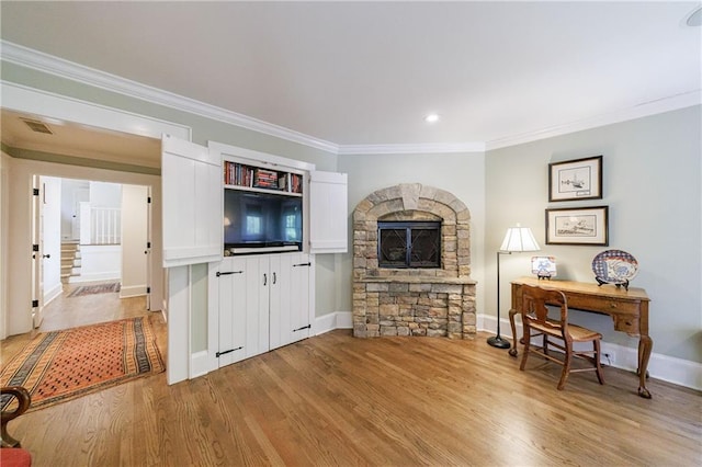 202 Lakeview Ave, Atlanta, GA 30305 - living area with a fireplace, ornamental molding, visible vents, light wood finished floors, and baseboards