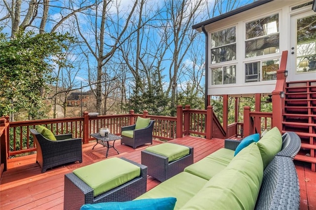 wooden deck with an outdoor living space