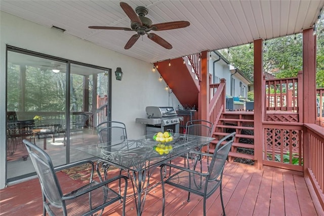 wooden terrace featuring grilling area and ceiling fan