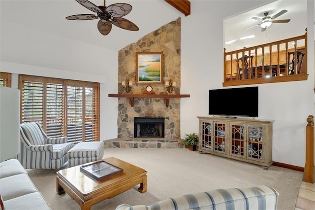 living room featuring a stone fireplace, high vaulted ceiling, light carpet, beamed ceiling, and ceiling fan