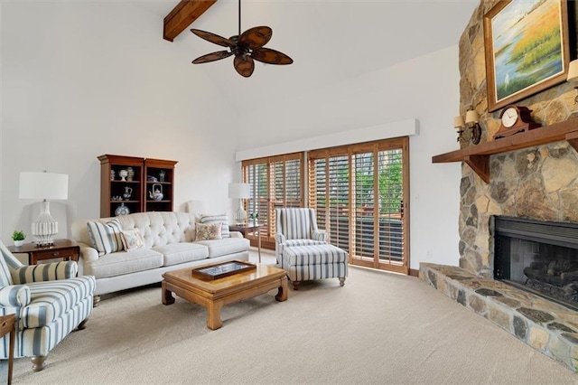 carpeted living room featuring beam ceiling, ceiling fan, high vaulted ceiling, and a fireplace