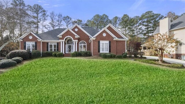 view of front of home with a front lawn