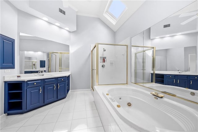 bathroom with lofted ceiling with skylight, vanity, ceiling fan, plus walk in shower, and tile patterned flooring