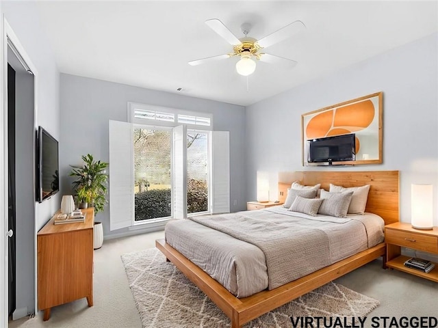 carpeted bedroom with ceiling fan