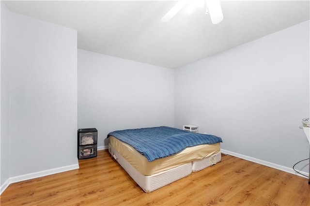 bedroom featuring ceiling fan and light hardwood / wood-style floors