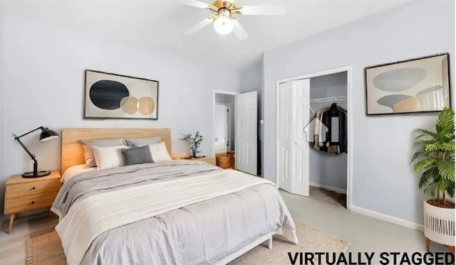 bedroom featuring light colored carpet, ceiling fan, and a closet