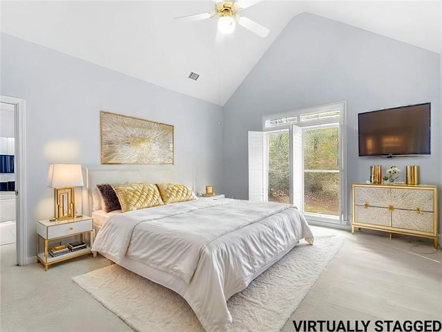 carpeted bedroom with high vaulted ceiling and ceiling fan