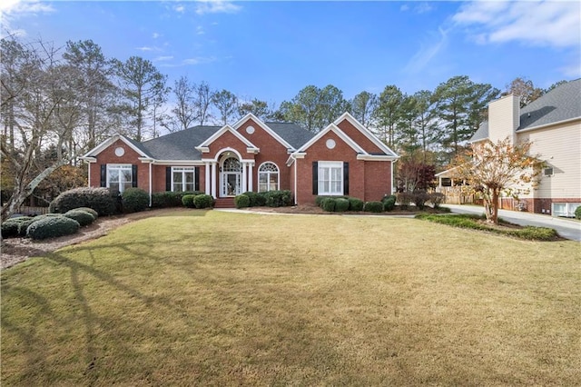 ranch-style house with a front lawn