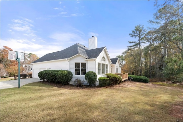 view of home's exterior featuring a wooden deck, a yard, and a garage