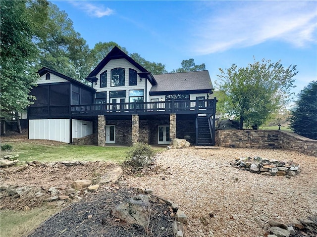 rear view of property featuring a deck