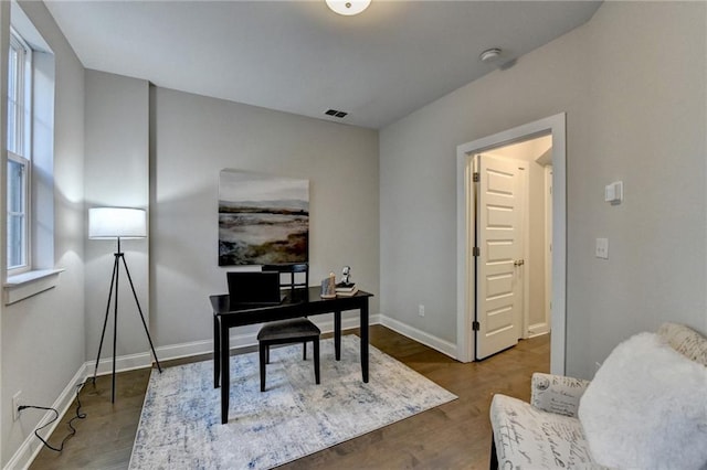 office area with wood-type flooring and a wealth of natural light