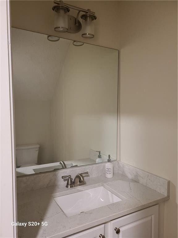 303 Tara Commons Cir, Loganville, GA 30052 - bathroom featuring vanity and toilet