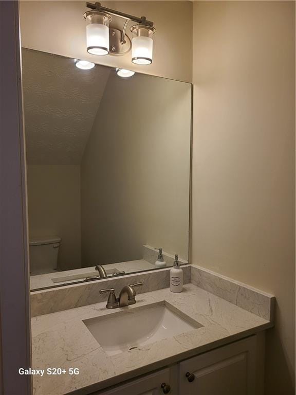 303 Tara Commons Cir, Loganville, GA 30052 - half bath featuring vanity and lofted ceiling