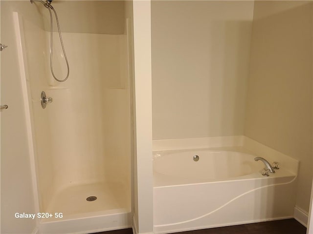 303 Tara Commons Cir, Loganville, GA 30052 - full bathroom featuring a bath and a shower